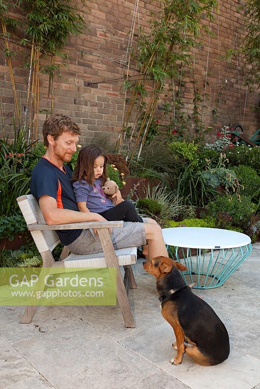 Garden owner Dave with daughter Mila enjoying their garden