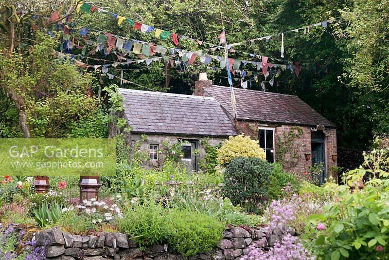 Sherpa's cottage and Nepalese prayer flags - July, Craigieburn, Moffat, Scotland