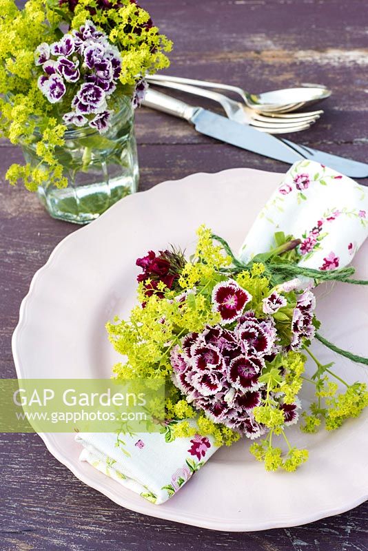 Summer table place setting with Dianthus barbartus - Sweet Williams and alchemilla mollis