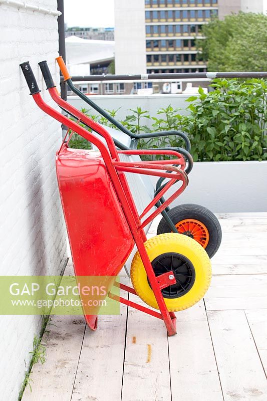 Wheelbarrows in the rooftop kitchen garden in the centre of Rotterdam, Holland.