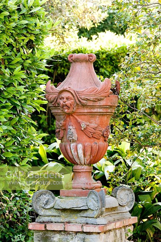 Ornament on plinth. La Limonaia Garden. Designed by Arabella Lennox Boyd. Fiesole. Florence. Italy