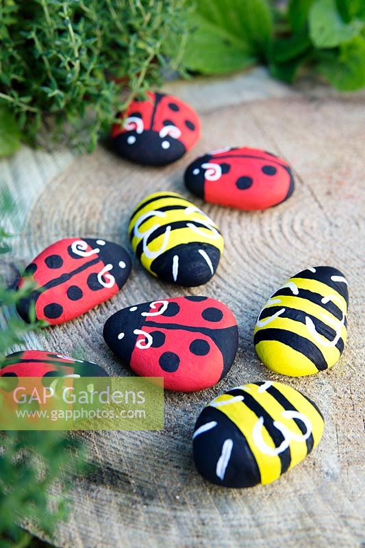 Garden craft making painted Bumble bees and Ladybirds with stones.  Finished Ladybirds and Bumble bees