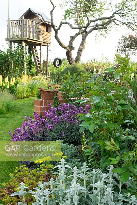 Summer planting with tree house retreat
