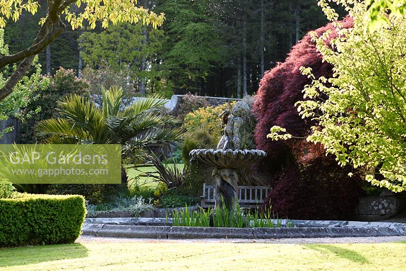 Central water feature in the walled garden at Tregrehan Gardens