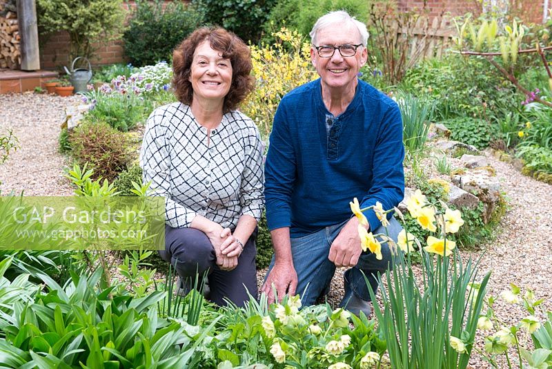 Richard Hobbs and Sally Ward in their front garden in early spring
