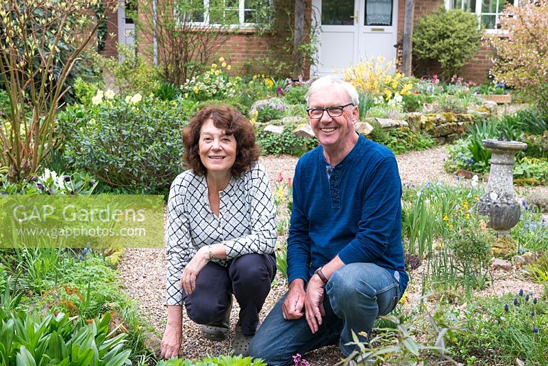 Richard Hobbs and Sally Ward in their front garden in early spring
