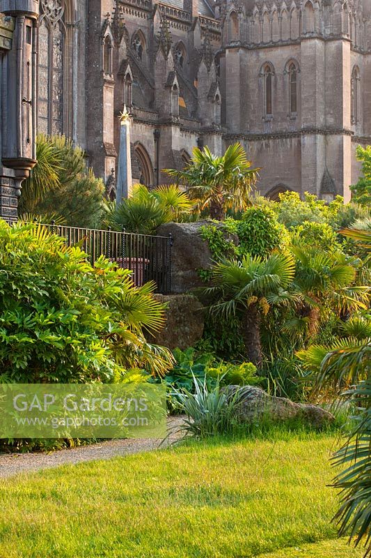 Border with Trachycarpus fortunei  - Collector earl's garden designed by Julian and Isabel Bannerman - Arundel Castle, West Sussex
