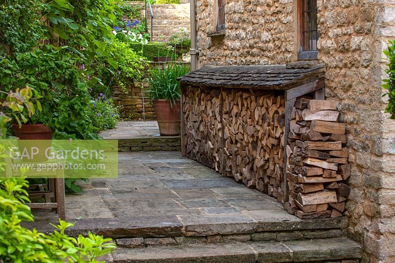 Stone steps with log store, Burford, Oxfordshire.