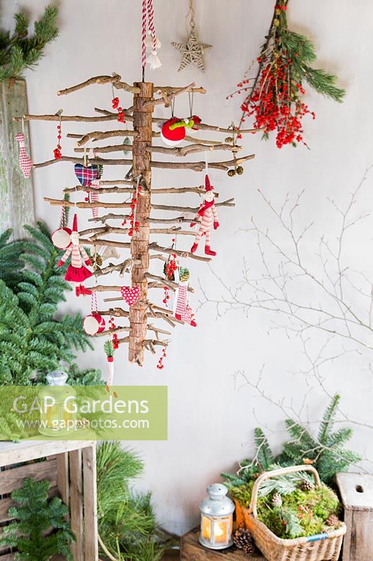 Upside down hanging Christmas tree in rustic setting