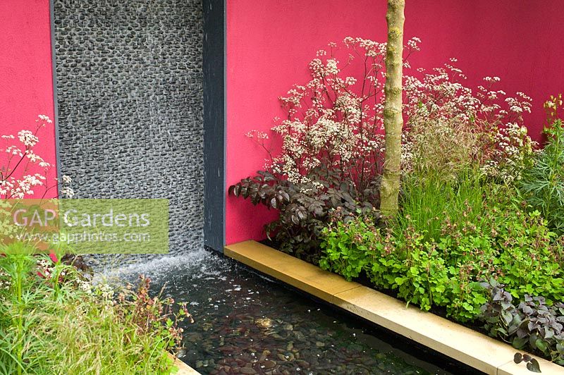 Contemporary garden with water feature. The Brewin Dolphin Garden, designer Robert Myers RHS Chelsea Flower Show 2013