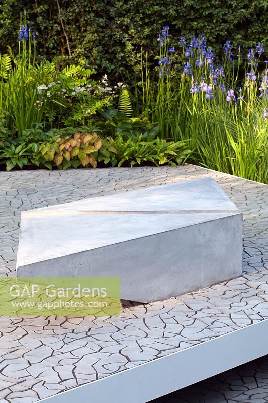 A modern concrete plinth seat in the RBC Waterscape Garden, RHS Chelsea Flower Show 2014, Designer Hugo Bugg