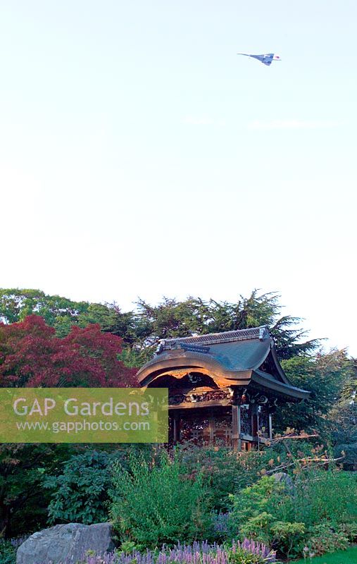 Concorde flying over the Japanese Garden at Royal Botanic Garden Kew, London for the last time