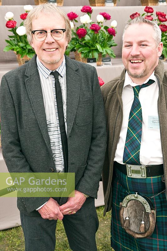 Billy Carruthers and Adam Fleming of Binny Plants on their Paeonia show stand at RHS Chelsea Flower Show 2012