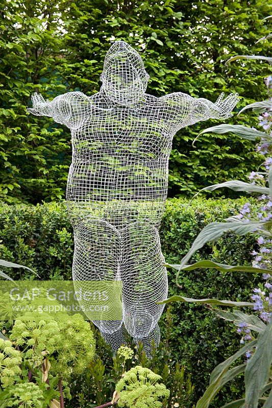 RHS Chelsea Flower Show 2013. The Arthritis Research UK Garden by Chris Beardshaw wire mesh figurative sculpture