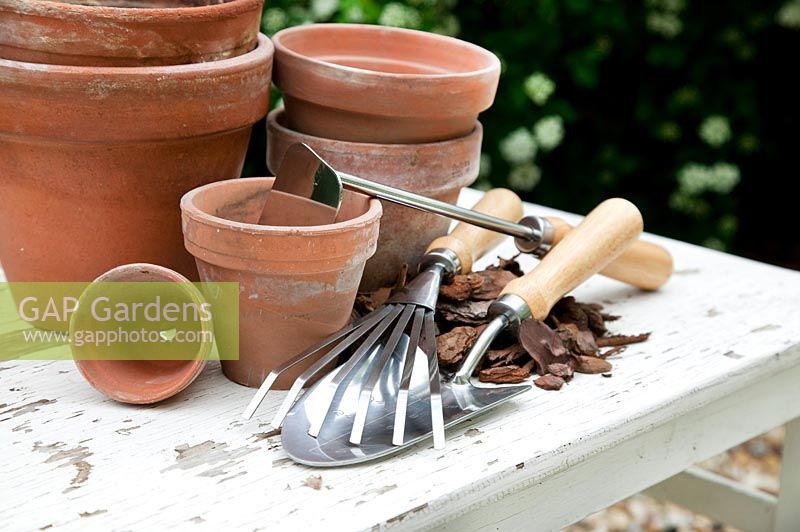 Garden tools with clay pots