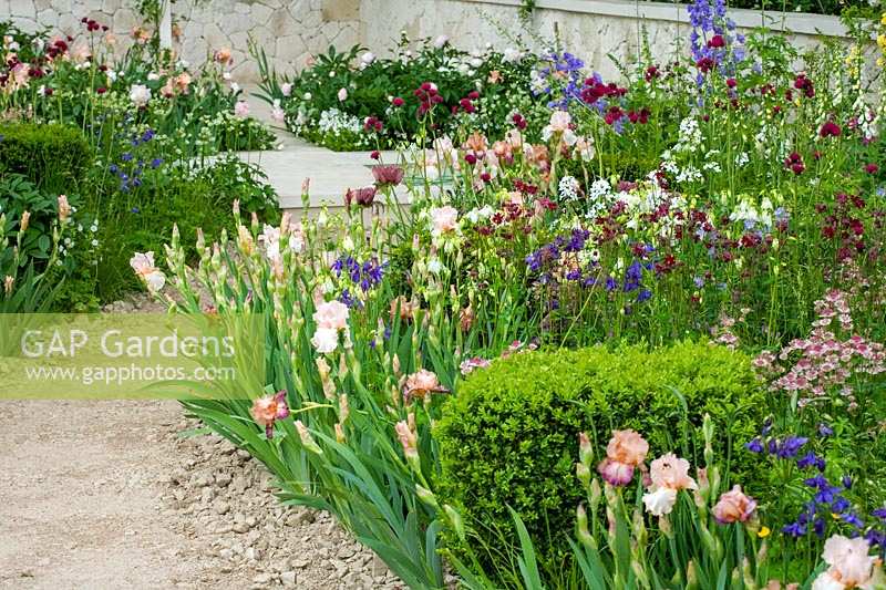 Chelsea Flower Show 2006, London, UK. 'The Laurent Perrier Garden' ( des. Jinny Blom ) romantic white and pink planting in informal flower garden