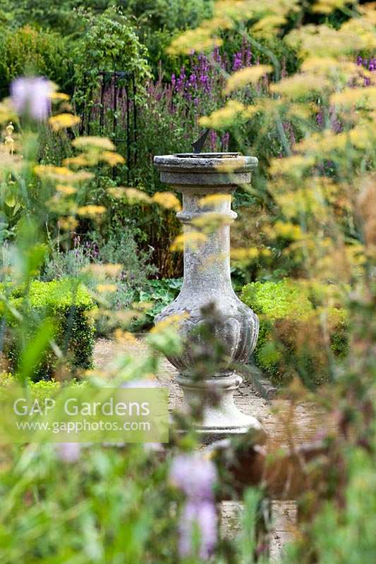 Capel Manor Gardens, London. Sundial in formal knot garden, parterre