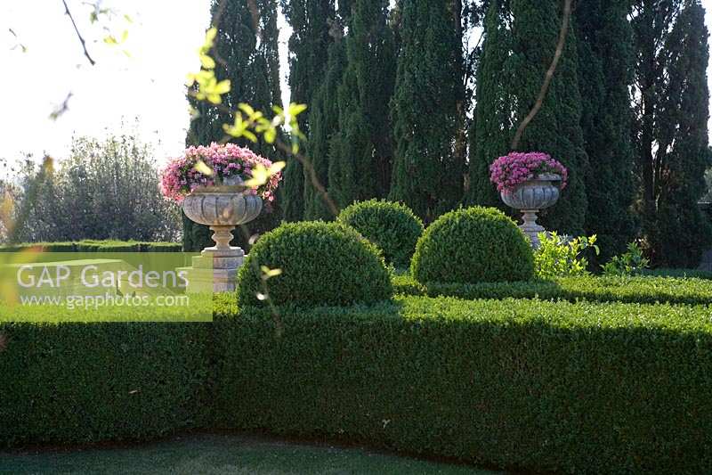 Villa La Foce, Tuscany, Italy. Large garden with topiary clipped Box hedging and views across the Tuscan countryside