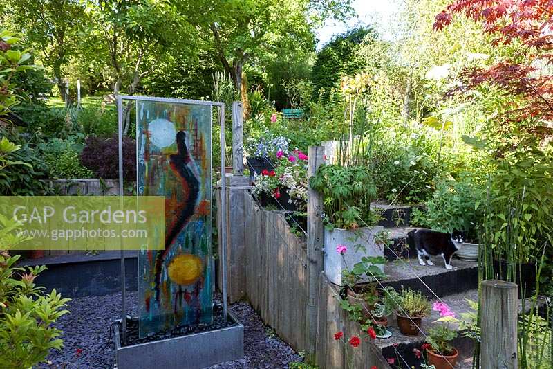 Carole Waller's garden at Bathford, Somerset, summer. Art installations in the garden by the artist Carole Waller