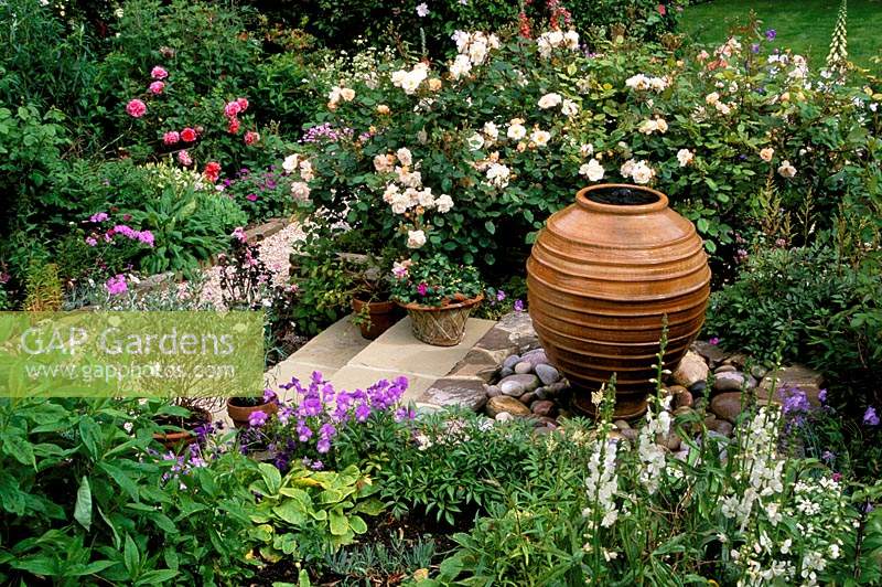 Private garden Sussex Pithoi water feature Shallow steps Rosa Penelope