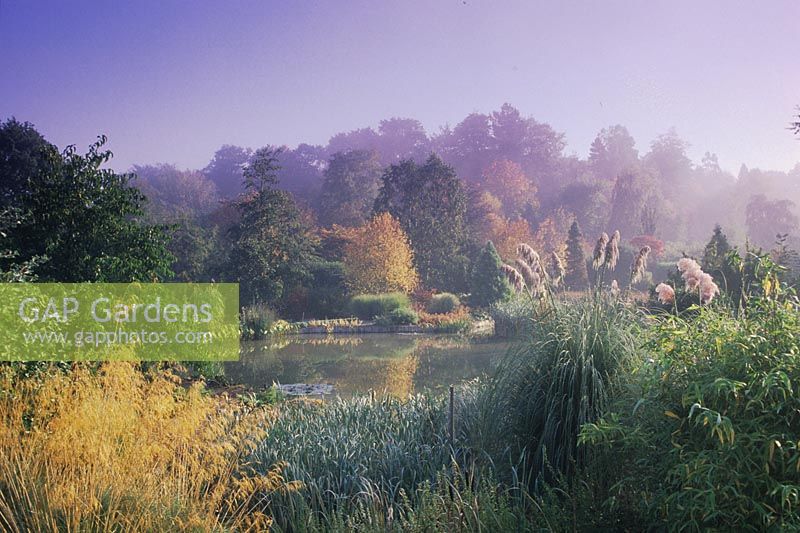 Hillier's Arboretum Hampshire the pond in autumn large pond autumn colour trees