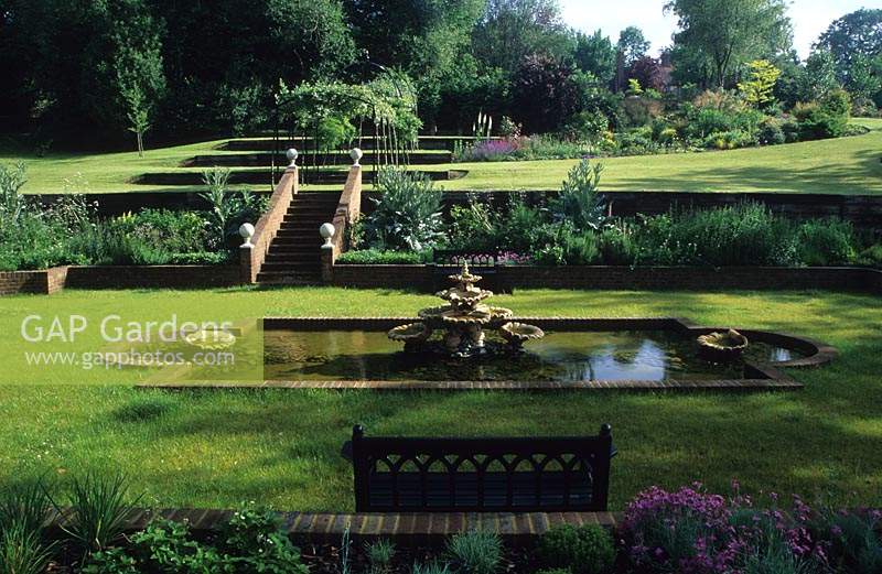 Shalford House Surrey design Sally Court sunken garden with formal brick edged pond with fountain