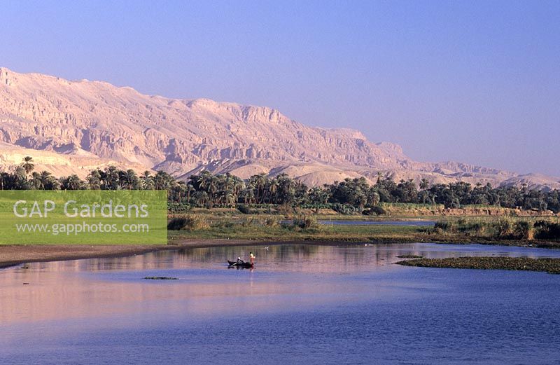 fishermen in small boat along the banks of the Nile near Luxor Egypt