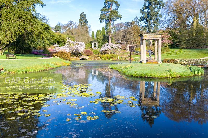 View of lake in The formal Temple Garden at Cholmondeley Castle, Cheshire, UK.