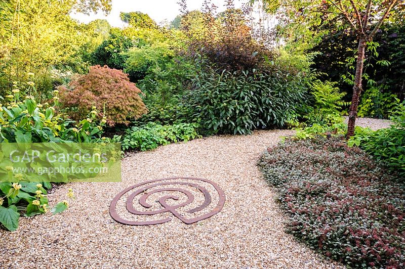 Mixed borders in the The Rust Garden, Dipley Mill, Hartley Wintney, Hants, UK. 