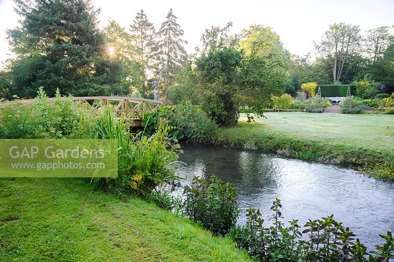 The River Whitewater runs through the garden, once providing water to power the mill. Dipley Mill, Hartley Wintney, Hants, UK