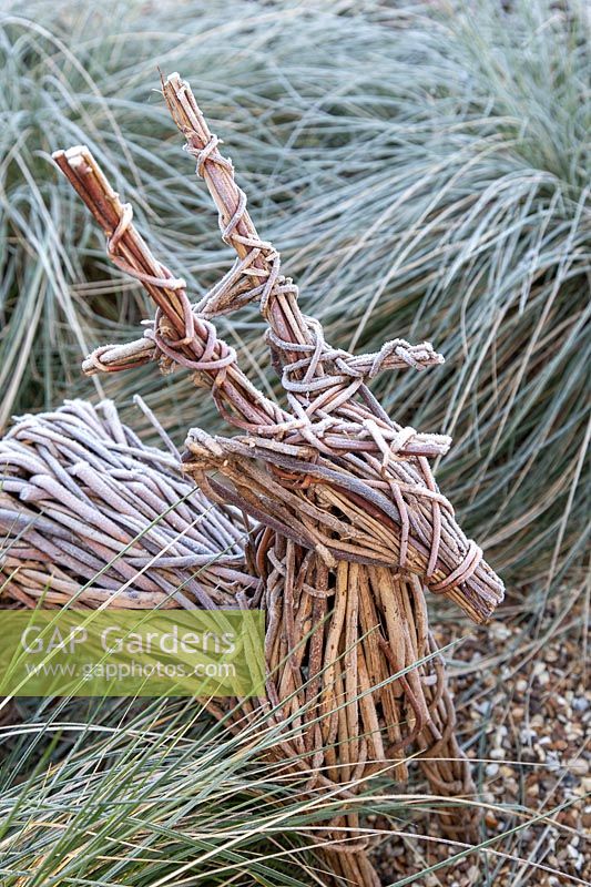 Woven deer garden ornament in frost. 