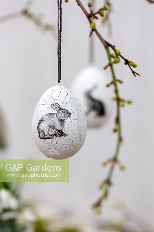 Decorative Easter egg with rabbit embellishment.