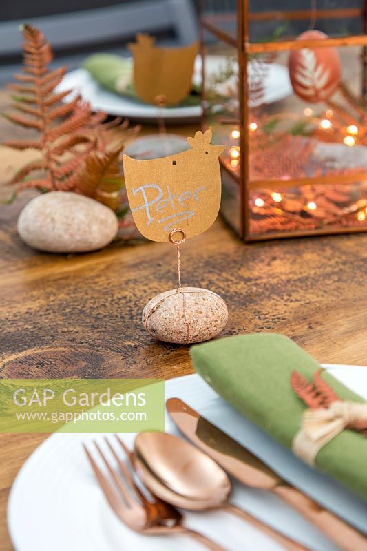 Easter place names made from chicken shaped cards fixed to pebble with copper wire