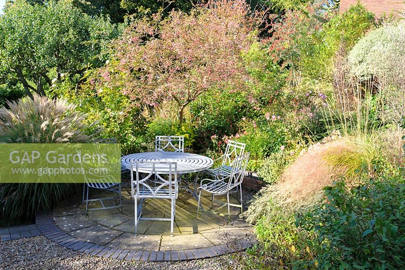 Garden seating area on patio, Shropshire, UK