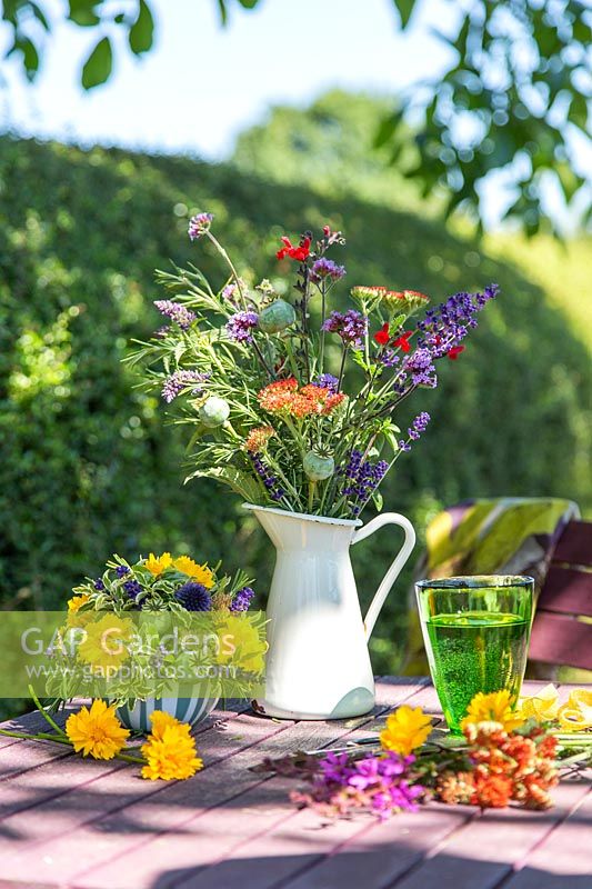 Garden table with floral arrangements