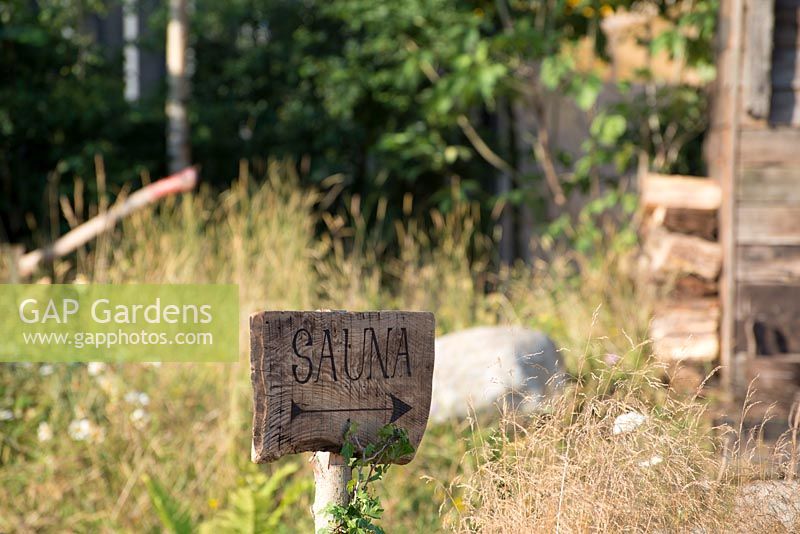 Sauna sign - The Viking Cruises Nordic Lifestyle Garden, RHS Hampton Court Palace Flower Show, 2018.