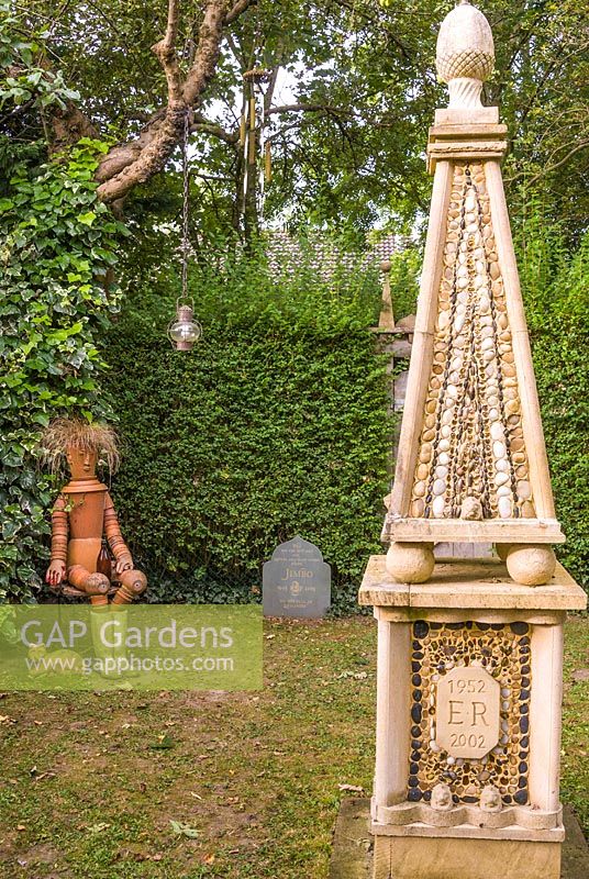 Obelisk built to commemorate the Queen's Golden Jubilee. The Secret Garden at Serles House, Dorset, UK.