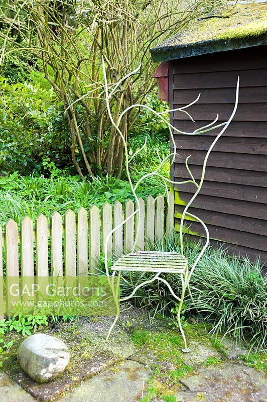 Metal seat by Dave Bissell. Moors Meadow Garden and Nursery, Bromyard, Herefordshire, UK