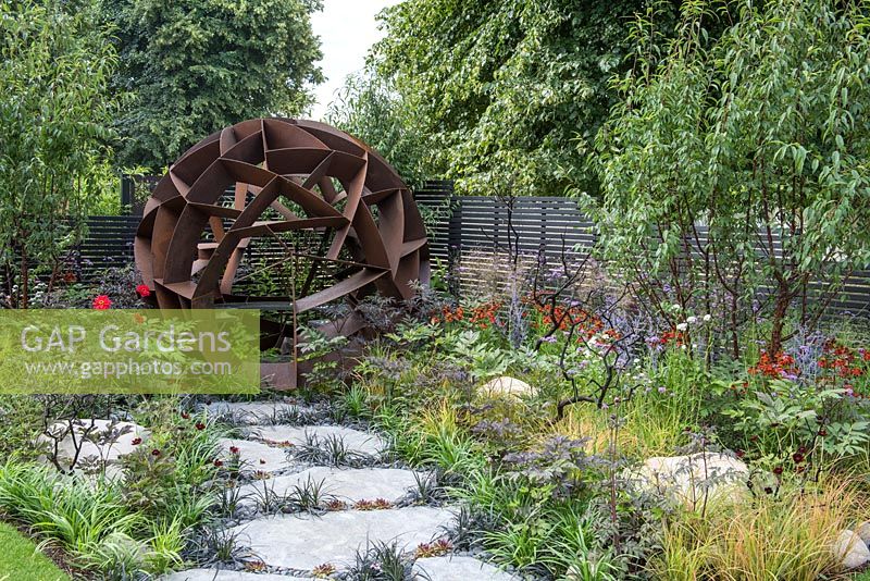 Corten steel sphere by William Roobrouck - Elements Mystique Garden, Sponsored by Elements Garden Design, RHS Hampton Court Palace Flower Show, 2018.