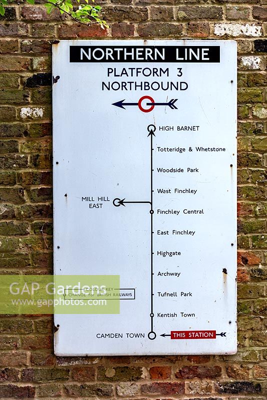 Vintage Northern Line Tube Map in contemporary garden in Highgate,  London. Garden designed by Peter Reader Landscapes.