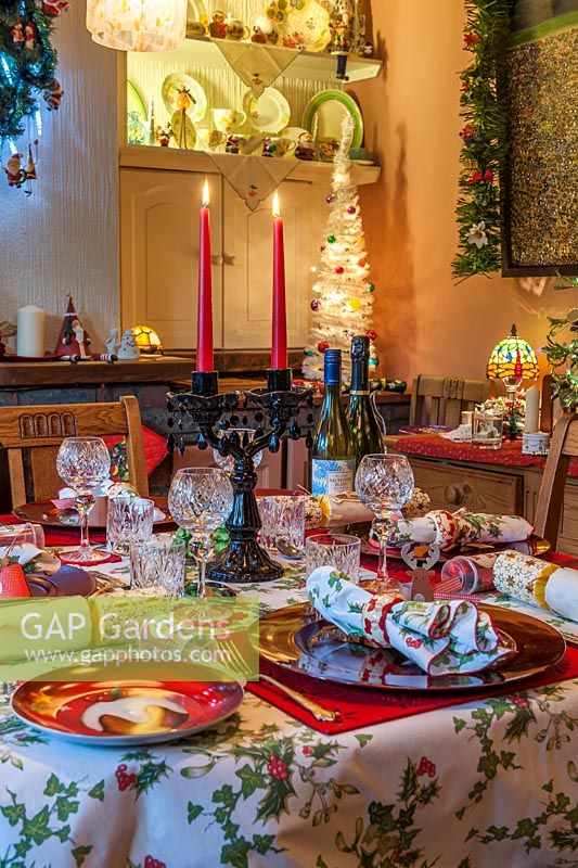 View of decorated dining table set for Christmas dinner. 