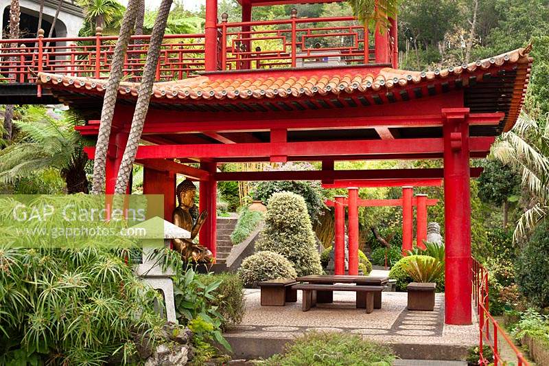 The double height Temple with gold buddha in the Southern Oriental garden in Monte Palace Tropical Garden