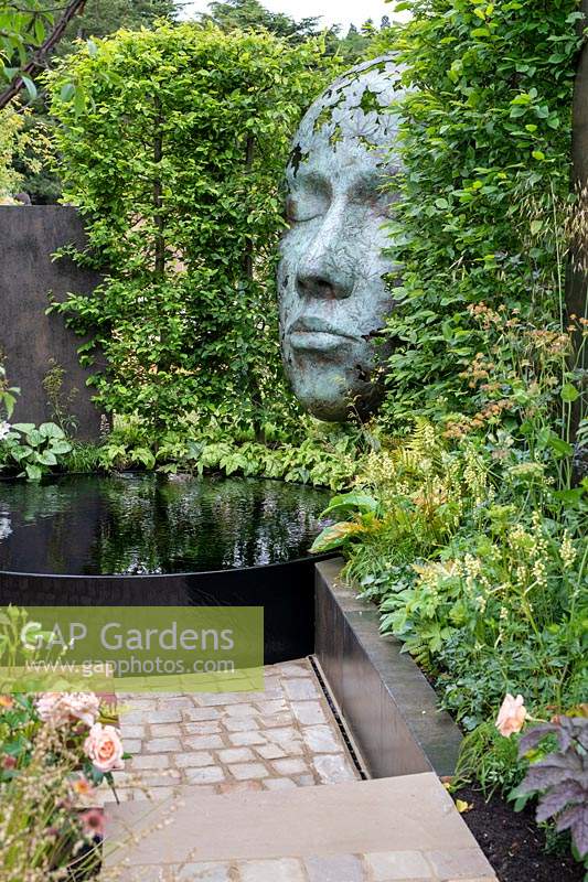 'The Thrive Reflective Mind' garden with raised pond, raised bed and sculpture
