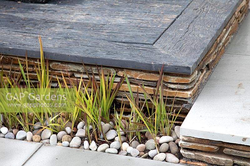 Hard landscaping levels in a 'A Glimpse of South East Asia' garden at BBC Gardeners World Live 2019