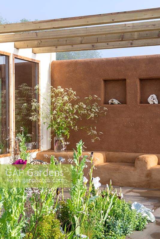 Studio with cob and clay plastered outdoor seating and pergola, jar of Cow Parsley - An Artist's Studio Home - Green Living Spaces, RHS Malvern Spring Festival 2019
