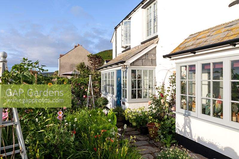 The Old Stone Cottage, Beesands, South Devon. The front garden of seaside cottage garden.
