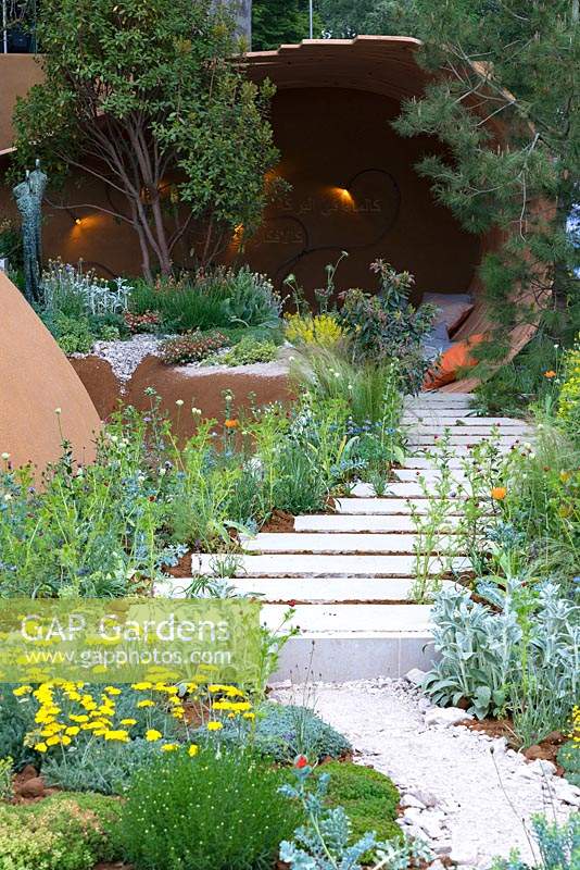 The Dubai Majlis Garden: White Limestone steps leading to the pavillion. Sponsors: DubaiRhs. Chelsea flower show 2019.