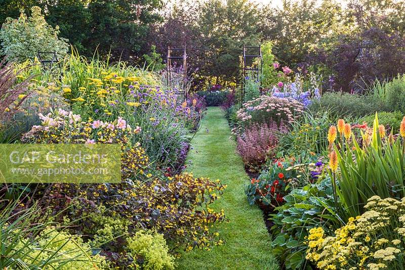 Double herbaceous borders with grass path 