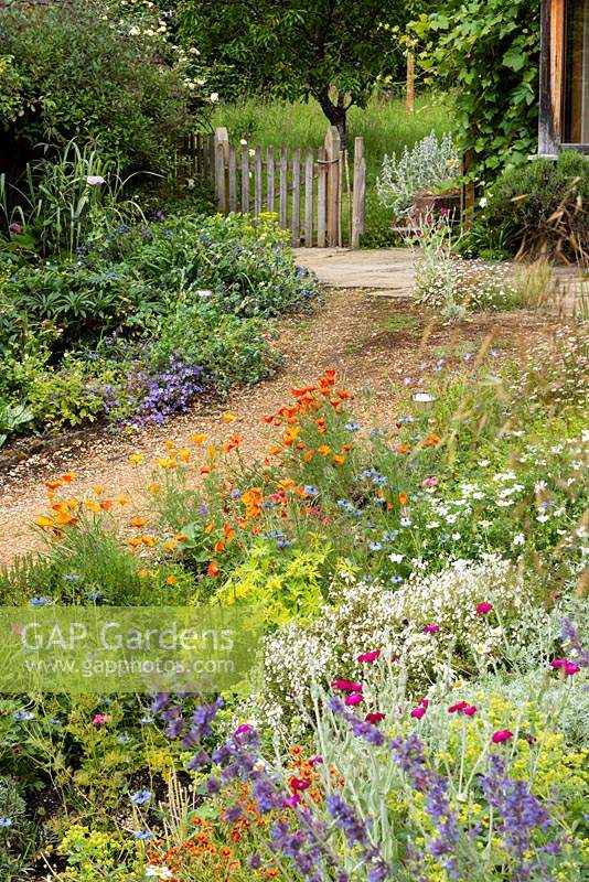 View across front garden to the gate which leads to the rear garden