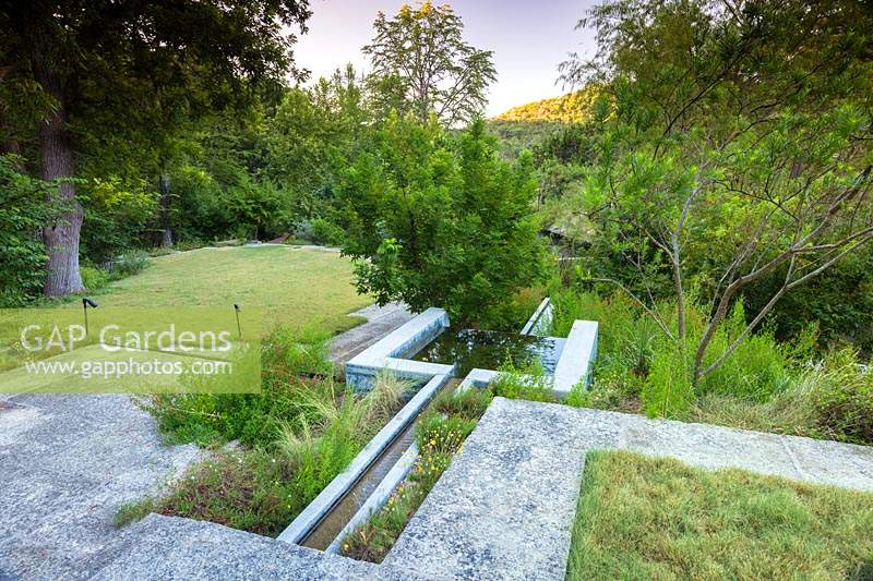 Integral concrete water feature at Mill Creek ranch in Vanderpool, Texas designed by Ten Eyck Landscape Inc, July.